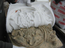 Taking the mould off a new rose and crown quadrant to complete a circle.