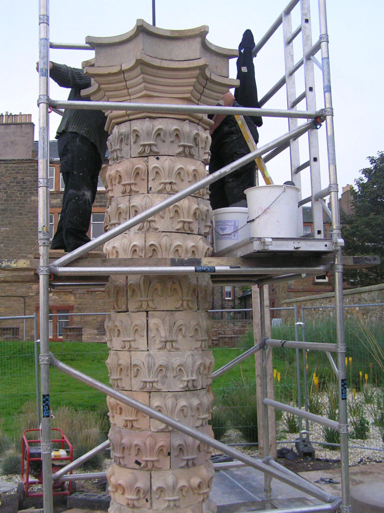 The fleur de lys pillar being constructed